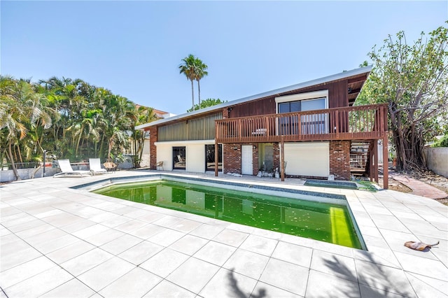 31 Dolphin Dr, Treasure Island, FL 33706 - swimming pool featuring a patio, fence, and stairway