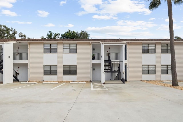 3102 W Horatio St Unit 13, Tampa, FL 33609 - view of property featuring stairway and uncovered parking