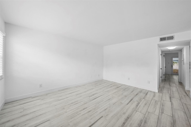 3102 W Horatio St Unit 13, Tampa, FL 33609 - unfurnished room with light wood-style flooring and baseboards