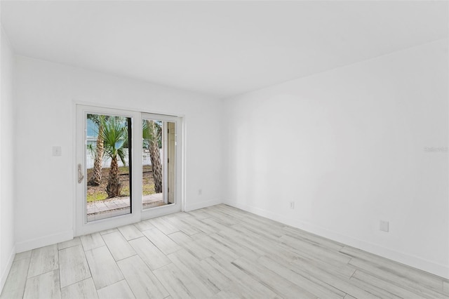 3102 W Horatio St Unit 13, Tampa, FL 33609 - spare room featuring baseboards