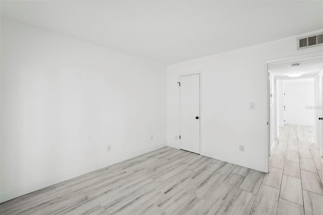 3102 W Horatio St Unit 13, Tampa, FL 33609 - unfurnished room featuring light wood-style flooring and baseboards