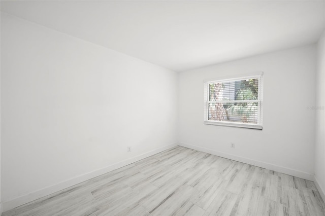 3102 W Horatio St Unit 13, Tampa, FL 33609 - unfurnished room featuring light wood-style flooring and baseboards