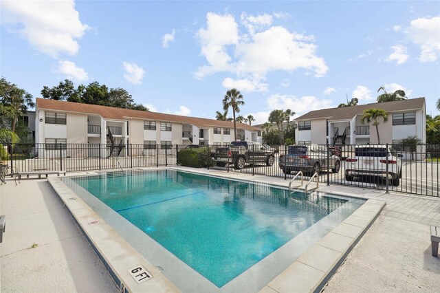 3102 W Horatio St Unit 13, Tampa, FL 33609 - community pool featuring fence and a residential view