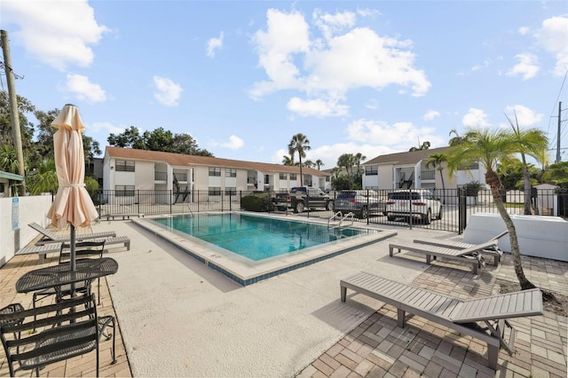3102 W Horatio St Unit 13, Tampa, FL 33609 - community pool with fence, a patio, and a residential view