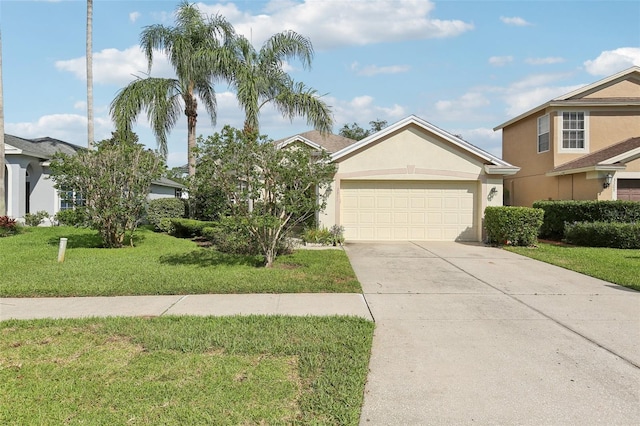 3311 Stonebridge Trl, Valrico, FL 33596 - view of front of house featuring a front yard, stucco siding, concrete driveway, and an attached garage