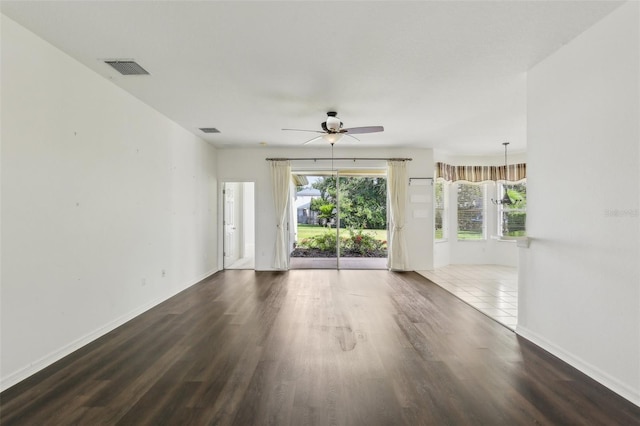 3311 Stonebridge Trl, Valrico, FL 33596 - unfurnished living room featuring a ceiling fan, wood finished floors, and baseboards