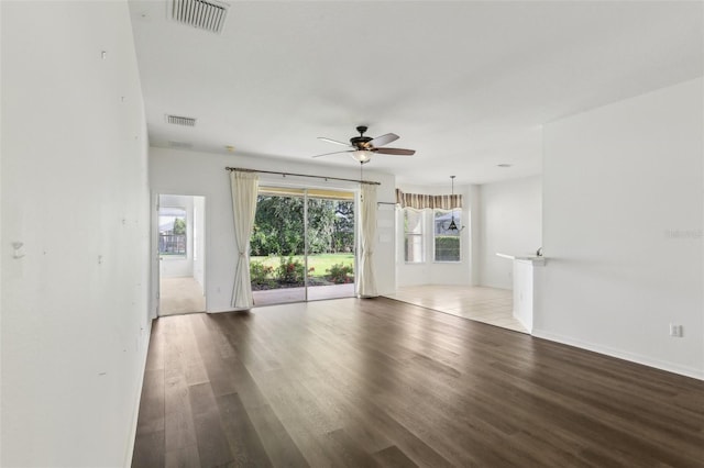 3311 Stonebridge Trl, Valrico, FL 33596 - unfurnished living room with ceiling fan, wood finished floors, and baseboards