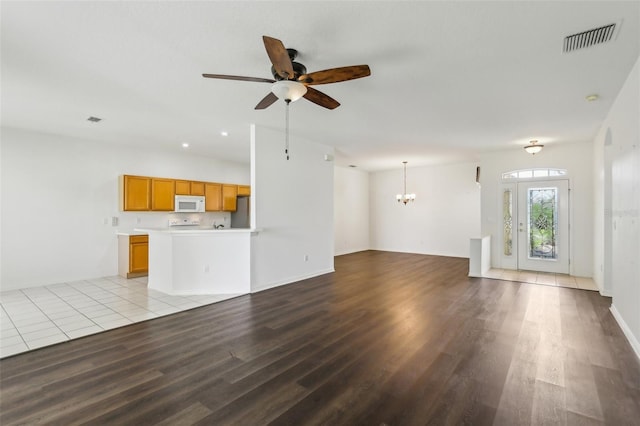 3311 Stonebridge Trl, Valrico, FL 33596 - unfurnished living room with wood finished floors, a ceiling fan, a chandelier, and baseboards