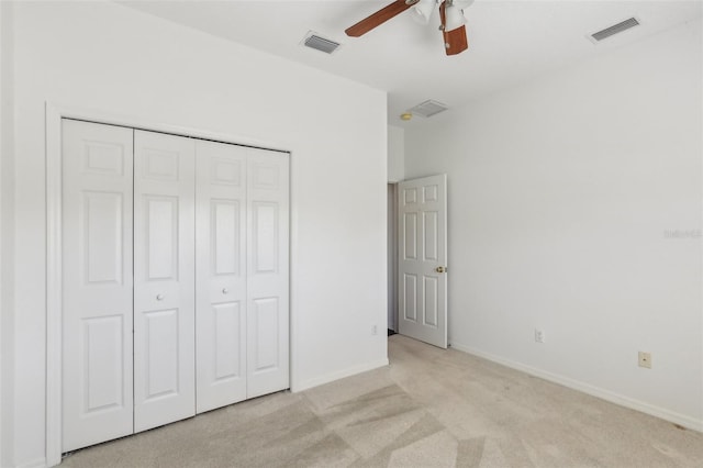 3311 Stonebridge Trl, Valrico, FL 33596 - unfurnished bedroom with light carpet, a closet, baseboards, and ceiling fan