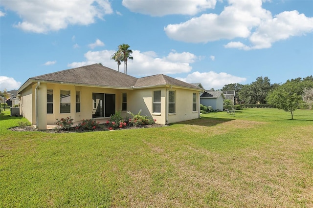 3311 Stonebridge Trl, Valrico, FL 33596 - rear view of house with a yard and stucco siding