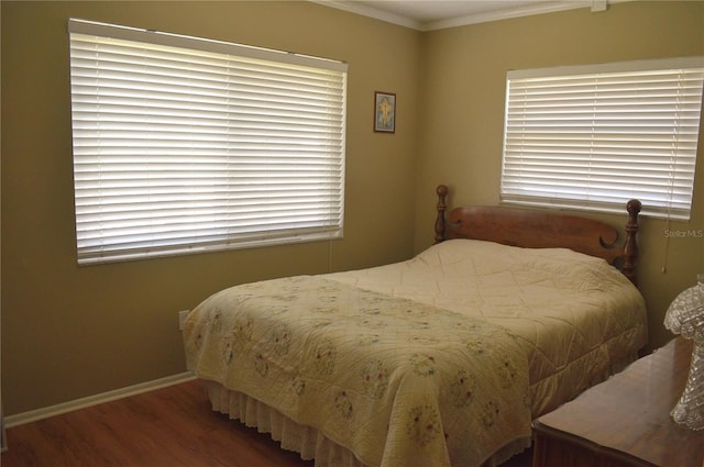 9639 Mainlands Blvd E, Pinellas Park, FL 33782 - bedroom with wood finished floors, crown molding, and baseboards