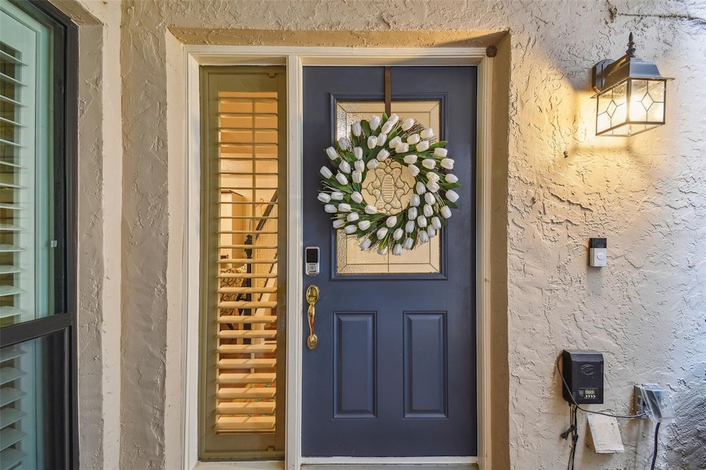 4222 Hartwood Ln Unit 1202, Tampa, FL 33618 - doorway to property featuring stucco siding
