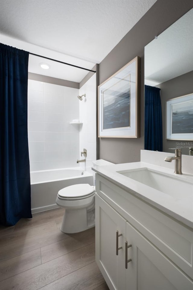 6236 SW 95th Pl, Ocala, FL 34476 - full bath with wood finished floors, toilet, shower / tub combo with curtain, and vanity