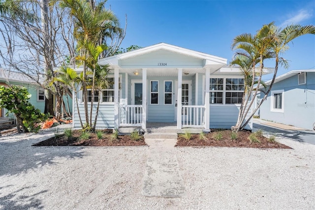13304 2nd St E, Madeira Beach, FL 33708 - view of front facade with covered porch