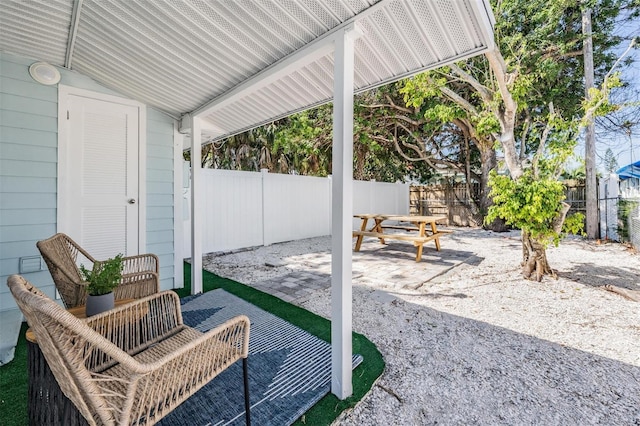 13304 2nd St E, Madeira Beach, FL 33708 - view of patio with a fenced backyard