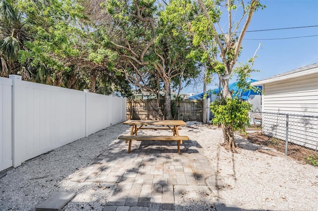 13304 2nd St E, Madeira Beach, FL 33708 - view of patio / terrace with a fenced backyard