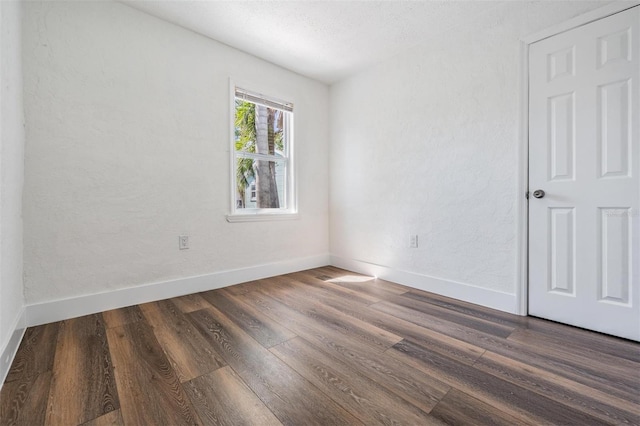 13304 2nd St E, Madeira Beach, FL 33708 - empty room featuring wood finished floors and baseboards