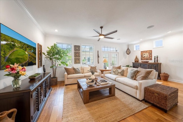 living room with ceiling fan, wood finished floors, recessed lighting, baseboards, and ornamental molding