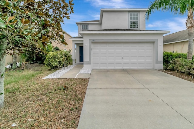 1107 Seminole Sky Dr, Ruskin, FL 33570 - traditional home with stucco siding, a garage, and driveway