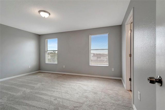 1107 Seminole Sky Dr, Ruskin, FL 33570 - unfurnished room featuring light colored carpet and baseboards