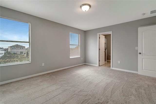 1107 Seminole Sky Dr, Ruskin, FL 33570 - unfurnished bedroom with carpet flooring and baseboards