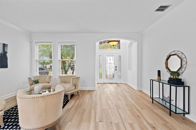 16206 Nottingham Park Way, Tampa, FL 33647 - foyer entrance featuring crown molding, wood finished floors, arched walkways, and baseboards