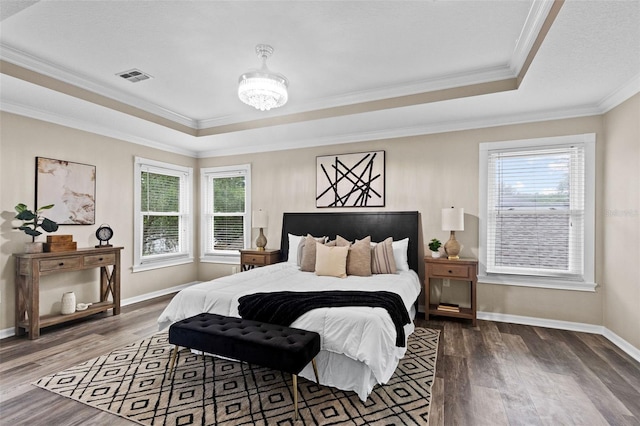 16206 Nottingham Park Way, Tampa, FL 33647 - bedroom featuring a raised ceiling, wood finished floors, crown molding, baseboards, and a chandelier