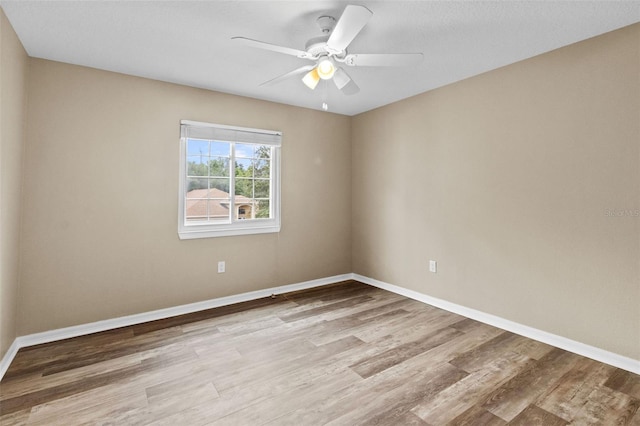 16206 Nottingham Park Way, Tampa, FL 33647 - unfurnished room with wood finished floors, baseboards, and ceiling fan