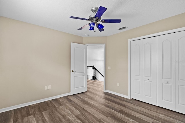 16206 Nottingham Park Way, Tampa, FL 33647 - unfurnished bedroom with wood finished floors, baseboards, a closet, and a ceiling fan