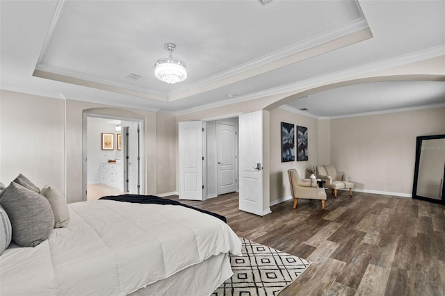 16206 Nottingham Park Way, Tampa, FL 33647 - bedroom with arched walkways, a tray ceiling, wood finished floors, crown molding, and baseboards