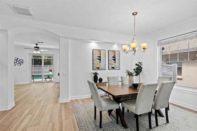 16206 Nottingham Park Way, Tampa, FL 33647 - dining area featuring light wood-type flooring, a ceiling fan, a chandelier, ornamental molding, and baseboards
