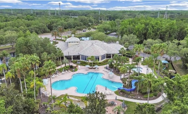 16206 Nottingham Park Way, Tampa, FL 33647 - community pool featuring a patio area and a wooded view