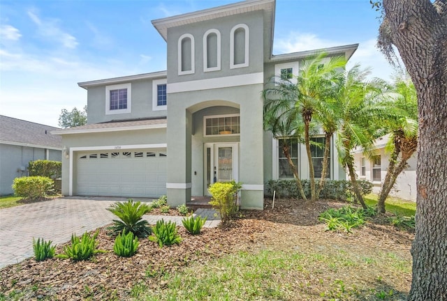 16206 Nottingham Park Way, Tampa, FL 33647 - view of front of house featuring stucco siding, a garage, and decorative driveway