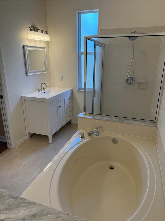 full bathroom with a garden tub, vanity, and a stall shower