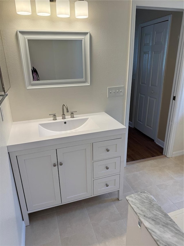 bathroom featuring tile patterned floors and vanity