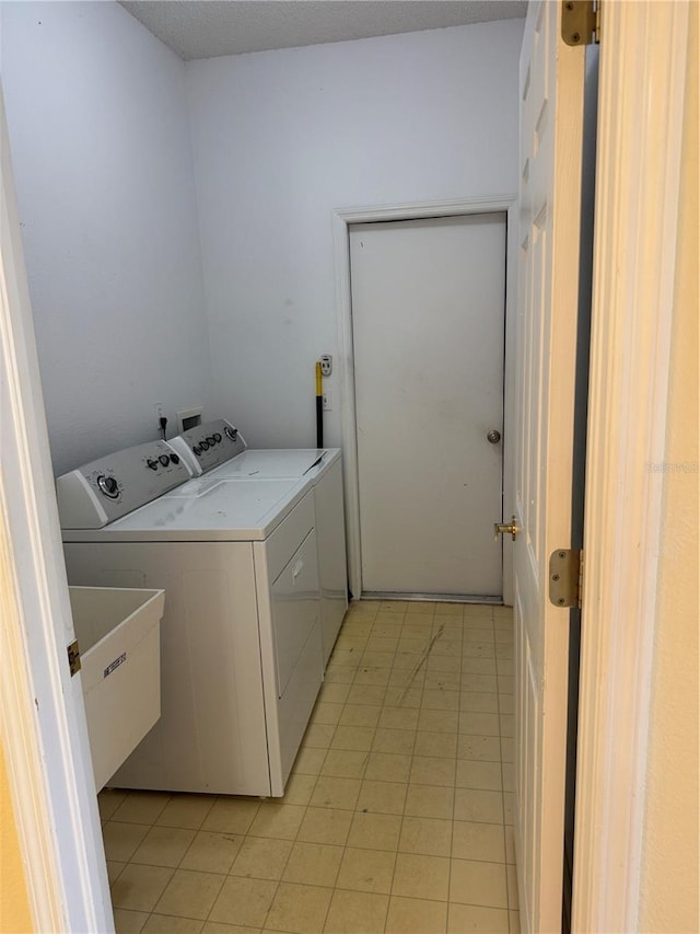 washroom featuring washing machine and dryer