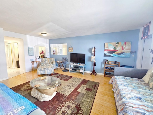 living room with wood finished floors and baseboards