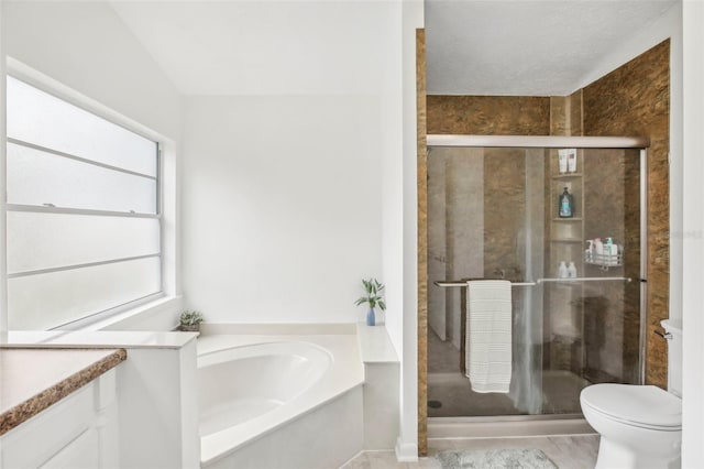 full bath with a shower stall, healthy amount of natural light, and a garden tub