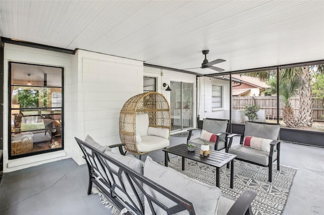 view of patio with fence, outdoor lounge area, and ceiling fan