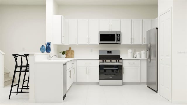 kitchen with stainless steel appliances, a sink, white cabinets, and light countertops