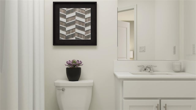 bathroom featuring toilet and vanity
