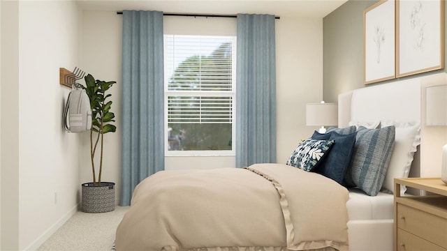 bedroom featuring carpet and baseboards