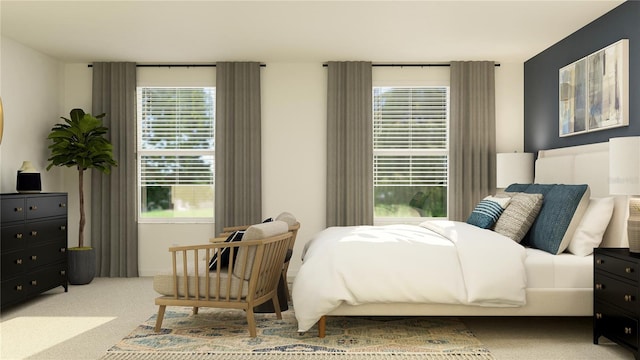 bedroom featuring multiple windows and carpet