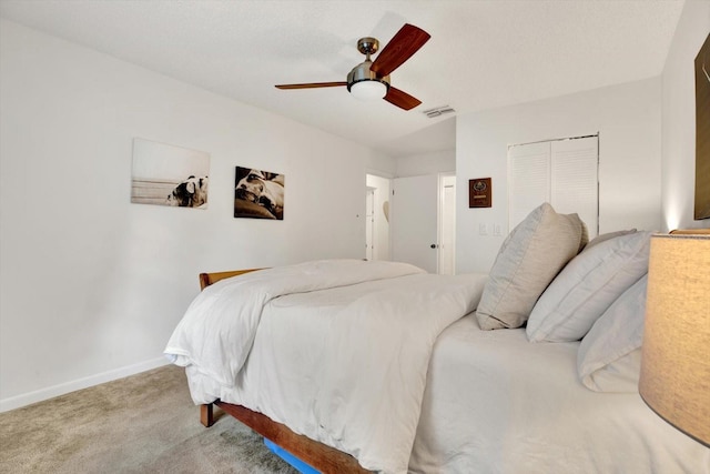 1390 Oak Hill Dr Unit 206, Dunedin, FL 34698 - bedroom featuring carpet floors, a closet, baseboards, and ceiling fan