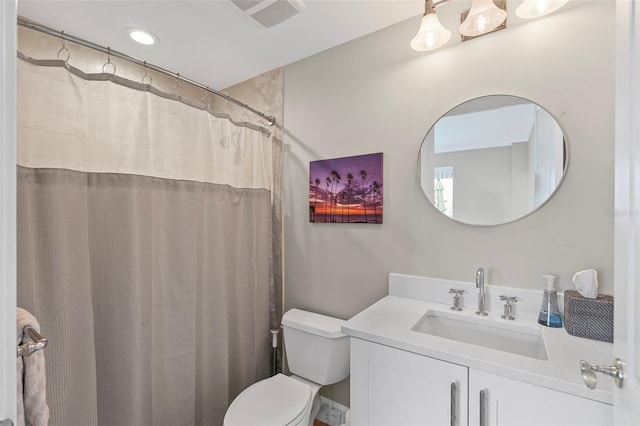 300 Beach Dr NE Unit 401, Saint Petersburg, FL 33701 - bathroom featuring toilet, vanity, and recessed lighting