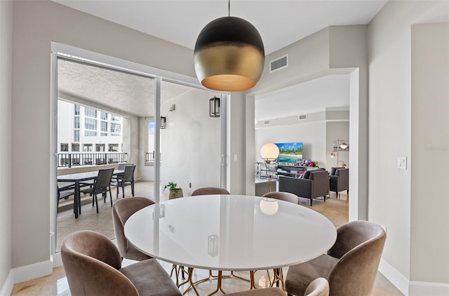 300 Beach Dr NE Unit 401, Saint Petersburg, FL 33701 - dining space with baseboards