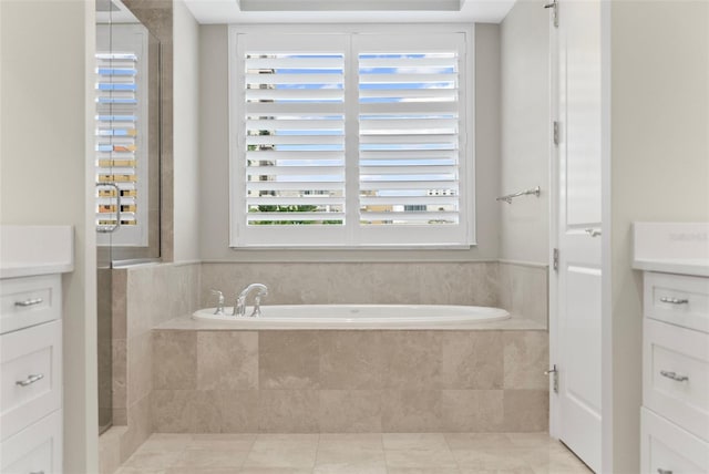 300 Beach Dr NE Unit 401, Saint Petersburg, FL 33701 - bathroom with vanity, a bath, a shower with shower door, and tile patterned flooring