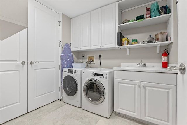 300 Beach Dr NE Unit 401, Saint Petersburg, FL 33701 - clothes washing area featuring independent washer and dryer and cabinet space