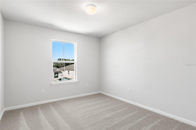 9066 Rally Spring Loop, Wesley Chapel, FL 33545 - empty room with carpet flooring and baseboards