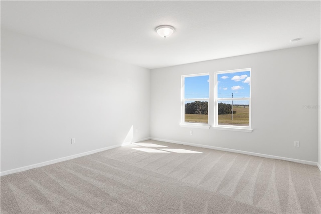 9066 Rally Spring Loop, Wesley Chapel, FL 33545 - unfurnished room featuring carpet and baseboards